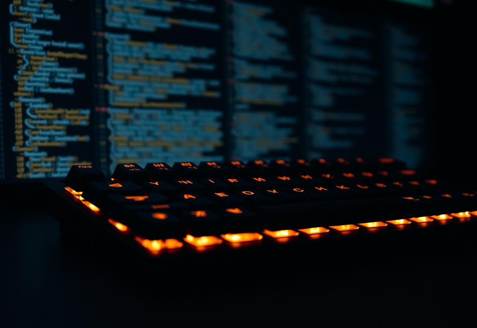 Backlit mechanical keyboard with code on screen